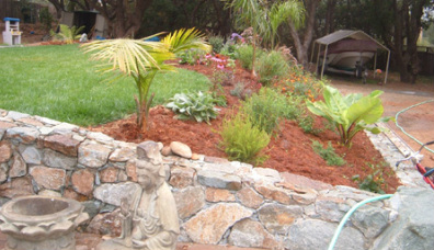 Stone wall and planter.